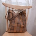 Brown vintage plaid canvas tote bag with large capacity for daily use shown on a chair - Coffee (Double Straps Shoulder)
