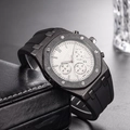 Close-up of black chronograph watch with octagonal bezel and rubber strap in a leather case - All Black Visible Screws Style(10)