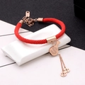 Rose gold pig year red rope bracelet with dollar money bag charm on white stand - Money Bag Style / Rose Gold