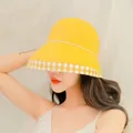 Detail of yellow cotton sun hat with gingham pattern brim worn by model outdoors - Yellow / M (56-58cm)