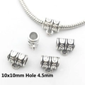 Macro shot of 10x10mm vintage silver bail beads for DIY jewelry making on white background - 8911-Silver Vintage