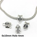 Macro view of 6x10mm antique silver bow beads with 4mm hole for DIY jewelry making - 8279-Antique Silver Barrel