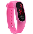 Macro shot of pink silicone sports band with red LED digital display showing time - Pink