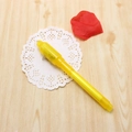 Yellow plastic invisible ink pen with UV light on white lace and wood background - Yellow