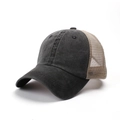 Close-up of distressed cotton denim and breathable khaki mesh on a baseball cap - Black