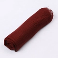 Detail shot of a dark red crinkle cotton scarf showing its soft breathable texture - Burgundy