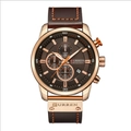 Detail of rose gold chronograph watch with brown leather strap and functional dials - Gold Case Coffee Dial