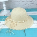Elegant beige straw sun hat with wavy brim, pearl beads, and large bow for summer beach - M (56-58cm) / Beige
