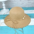 Close-up of woven straw hat featuring decorative beads and a delicate bow detail - M (56-58cm) / Light Coffee