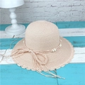 Detail of woven straw sun hat with beaded cord, bow accent, and wavy scalloped brim - M (56-58cm) / Light Pink