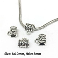 Detailed view of 8x10mm vintage silver beads with floral patterns and 5mm hole - 8280-Silver Beaded