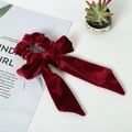 Elegant wine red velvet bow scrunchie with long ribbons on a white decorative setting - Velvet / Long Ribbon Bow Style / Burgundy