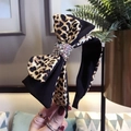 Leopard print and black fabric bow headband with sparkling crystal rhinestones center - Leopard Yellow