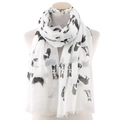 Detail of white scarf featuring black dog prints and elegant fringe tassels on the edges - White