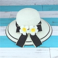 Creamy white straw sun hat for women featuring a black bow ribbon and plumeria flowers - M (56-58cm) / Creamy White