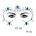 Detail view of emerald and pearl face gems with symmetrical layout on clear backing - YT-31