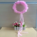 Detail of pink feather halo headband featuring long ribbon tails for party hair accessories - Pink Garland