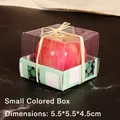 Small gift box with red apple candle, 5.5x5.5x4.5cm size, transparent lid and green base - Apple Candles Small Size