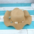 Women's khaki straw sun hat with wide wavy brim and delicate floral band for summer beach - Adult M / Light Coffee