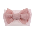 Detailed view of pink waffle texture bow on soft nylon elastic headband for baby girls - Light Pink