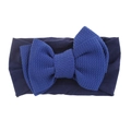Detail view of navy blue waffle knit fabric and soft knot bow on elastic baby headband - Navy with Royal Blue Bow