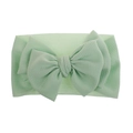 Detail of mint green baby headband with waffle texture and oversized bow ornament - Pre-tied Bow / Mint Green