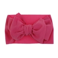 Detailed macro view of the bright pink ribbed fabric and oversized bow on a baby headband. - Pre-tied Bow / Rose Red