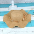 Beige wide-brim straw sun hat with wave edges and decorative floral ribbon - Adult M / Khaki