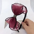 Close-up of wine red lace bow headband with sparkling rhinestone center and black band - Mesh Wine Red