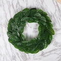 Realistic artificial magnolia leaf wreath for home wall decor on marble surface - Magnolia Leaf Wreath