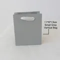 Grey vertical paper jewelry gift bag with white ribbon handles and 11x6x13cm dimensions - Gray Handbag (11x6x13cm)