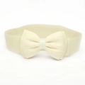 Close-up of cream elastic corset belt featuring a large 3D satin bow decoration - Off White