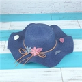 Navy blue wide-brimmed straw sun hat with wavy edges and floral ribbon decorations - M (56-58cm) / Navy Blue
