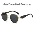 Gafas de sol poligonales con montura de metal dorado y lentes gris negro para mujer - Montura Dorada Patas Negras Lentes Gris Negro