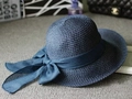 Navy blue woven sun hat with wide brim and matching large ribbon bow decoration - Navy Blue
