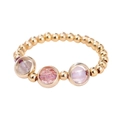 Goldenes Perlenarmband mit drei gefassten natürlichen rosa-violetten Kristallen - Ring