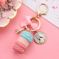 Three-layer macaron keychain with pink bow and Eiffel Tower charm in gold finish - Blue & Pink