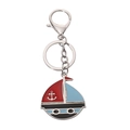 Cartoon sailboat keychain with red and blue sails and a silver anchor emblem - Sailboat 3