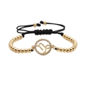 Close-up of golden beaded Capricorn bracelet with sparkling pavé zircons and woven cord - Capricorn