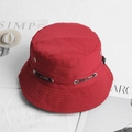Close-up of red cotton sun hat featuring metal vents and adjustable SPORT drawstring - Burgundy
