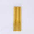 Macro shot of metallic gold spiral paper straws in a clear plastic package on white background - Gold Foil Straws