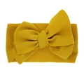 Mustard yellow baby elastic headband with a wide waffle texture and large bow - Ginger Yellow