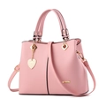 Pink faux leather fashion handbag for women with heart pendant and gold hardware - Pink