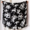 Detail of black cotton scarf with white floral print and delicate fringe edges - 180x90cm / Black Printed
