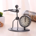 Vintage black iron desk clock featuring a creative musician figurine in metalwork - C63 Flute Clock
