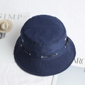 Detailed close-up of navy blue canvas bucket hat with adjustable side drawstrings - Navy Blue