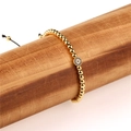 Vergoldetes Perlenarmband mit blauem Evil Eye Anhänger und schwarzer Kordel - Böses Auge