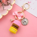 Pink ribbon bow keychain with Macarons and Eiffel Tower charm on a gold metal ring - Pink and Coffee