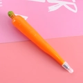 Creative carrot-shaped ballpoint pen in vibrant orange with green leafy details - Carrot