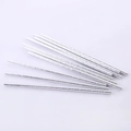 Detail view of twelve silver spiral patterned paper straws for party use on white background - Silver Spiral Pattern Straws